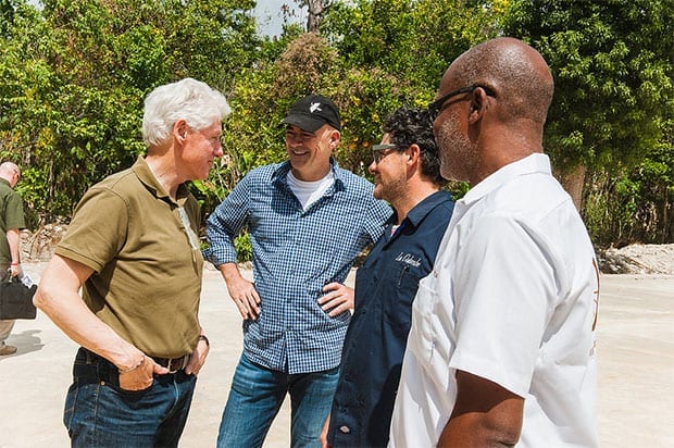 Bill Clinton talking with TechnoServe workers