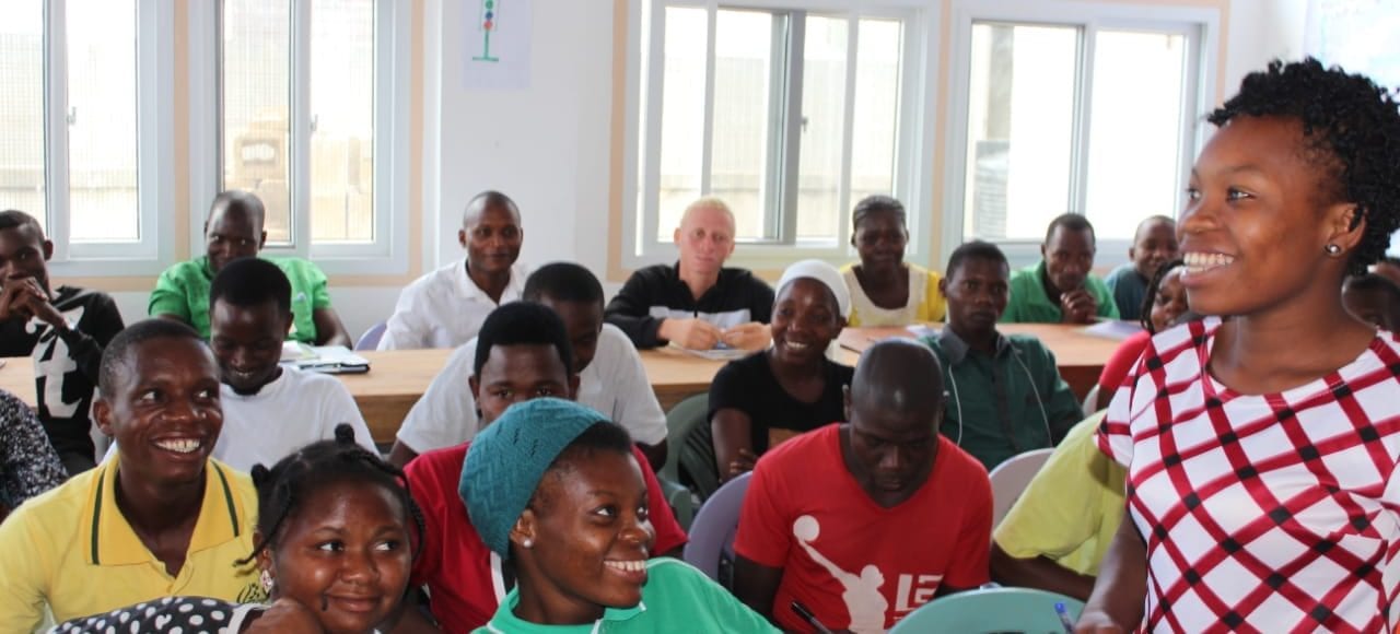 Group of people in classroom smiling