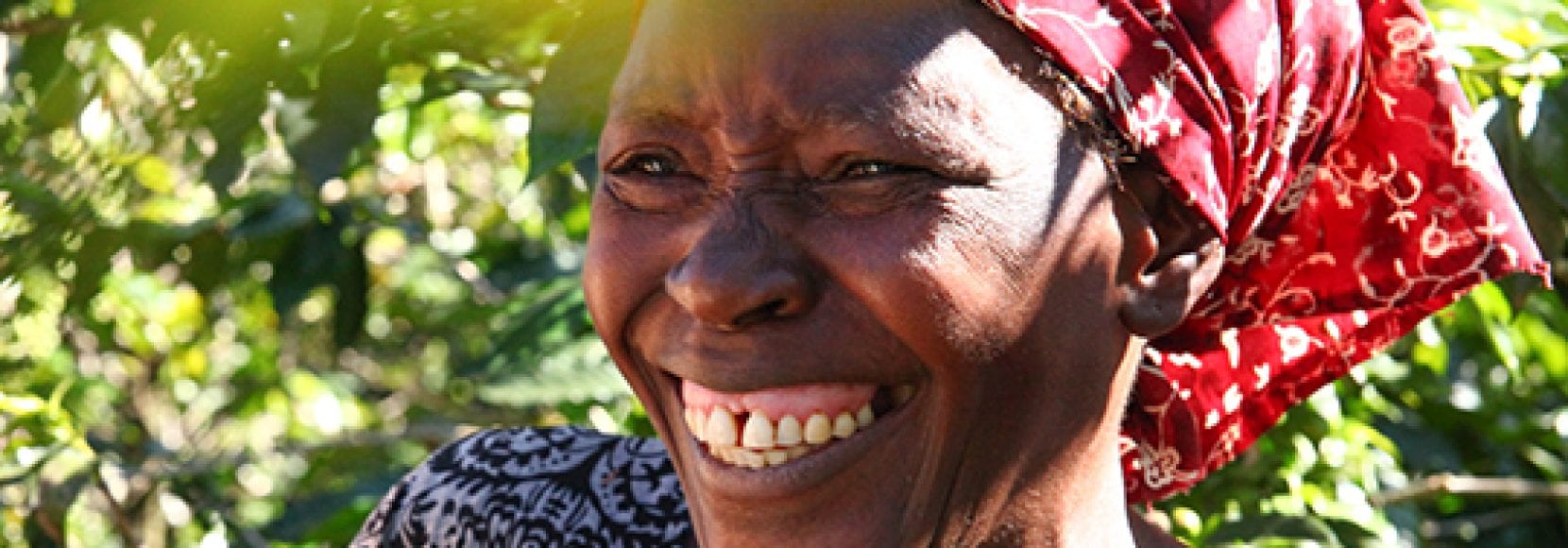 Woman smiling while working in Zimbabwe