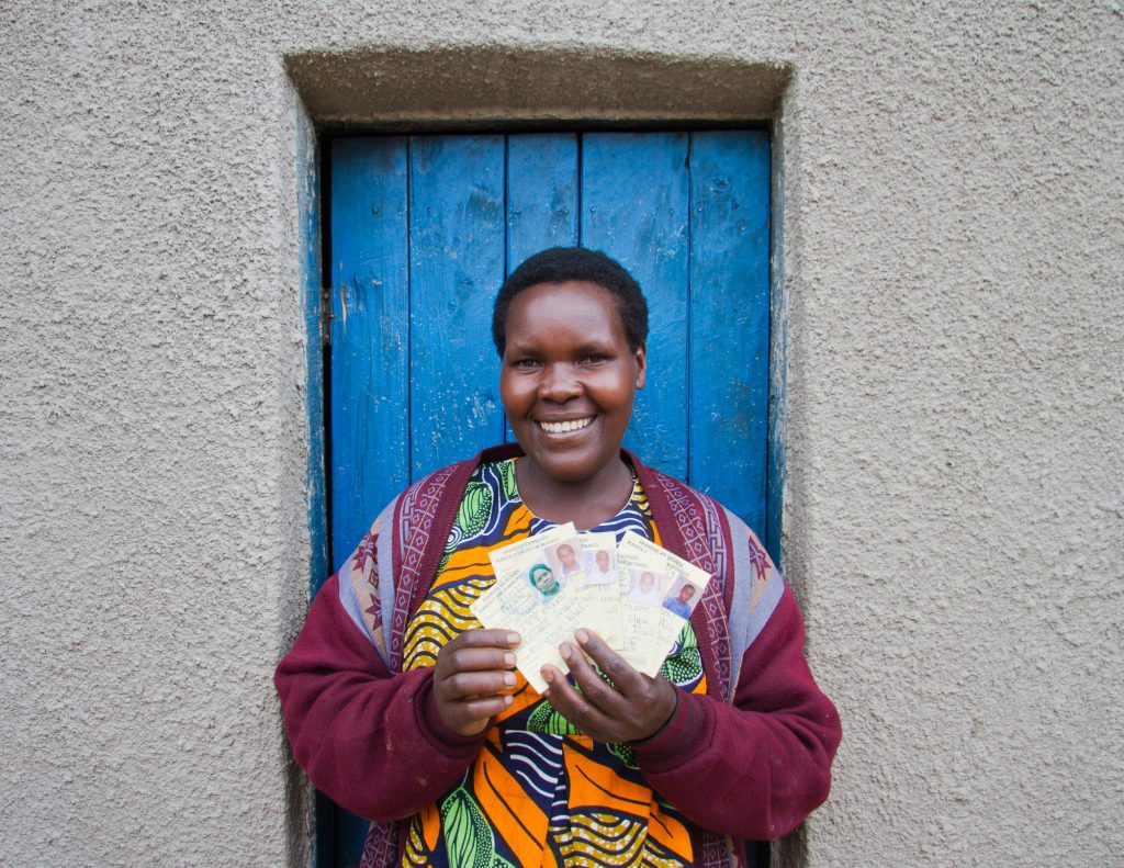 Jackeline Mukandori with "enhanced" health care cards for her family, Mizero cooperative, Coffee Initiative, Nyanza district, Rwanda. Photo © 2011 Nile Sprague