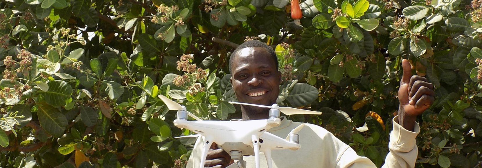 Man smiling holding drone