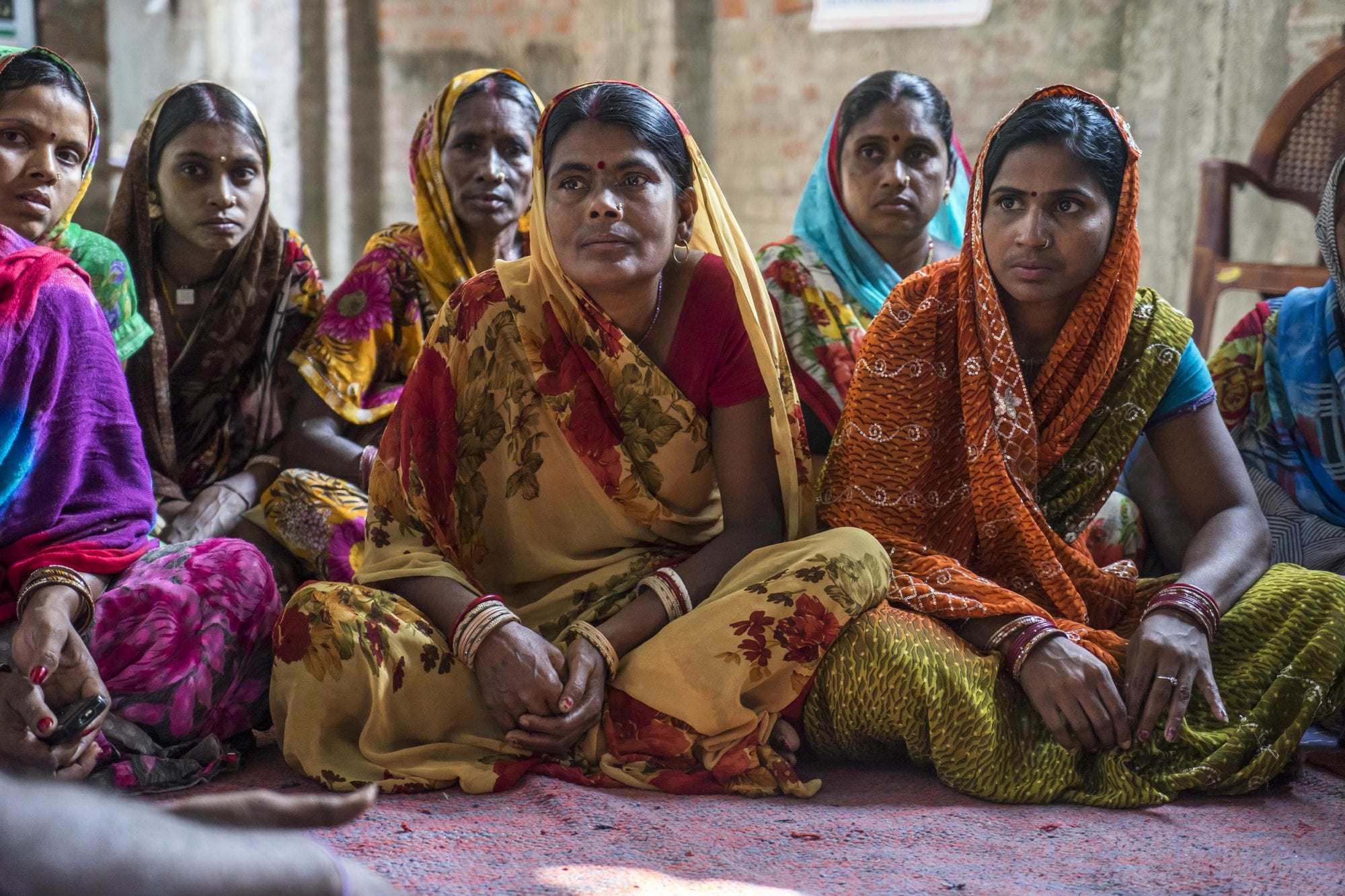 Women vegetable farmers have a discussion during a producer group meeting in Machahi village, Muzaffarpur, Bihar, India.