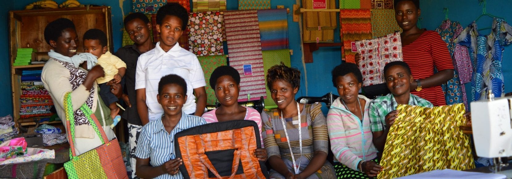 Group of happy people sewing in East Africa