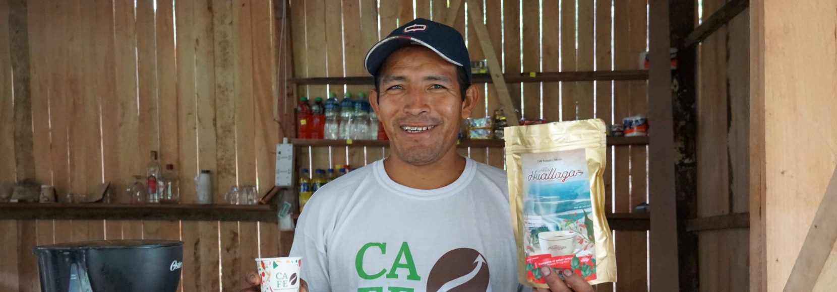 Cruz Juanan stands in his coffee shop in Peru