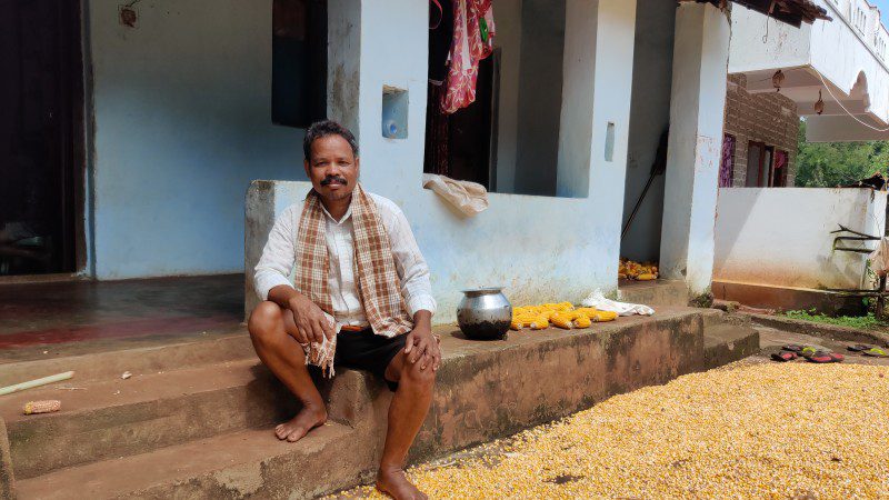 Mottadam Jogiraju sits in front of his home in India