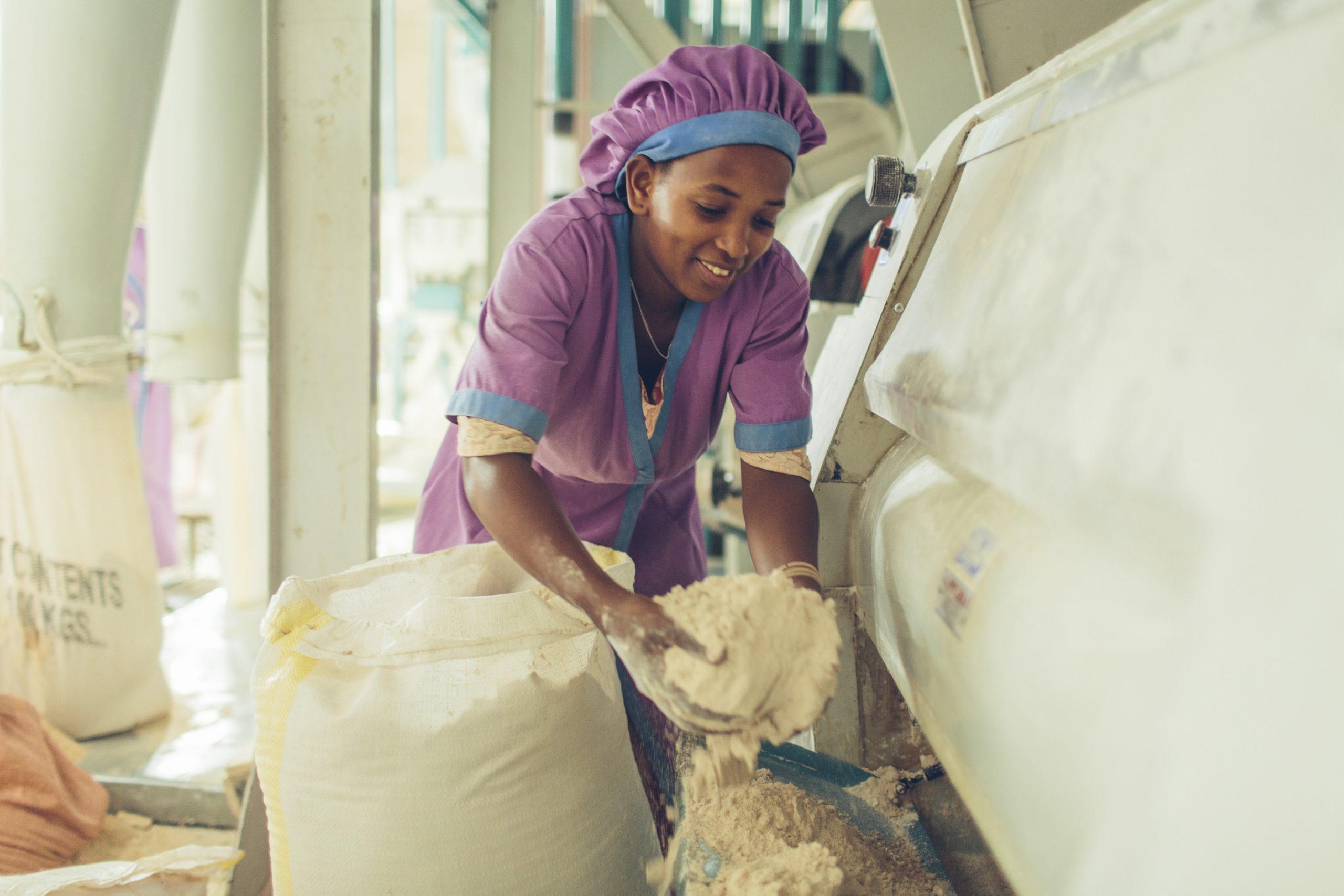 A woman worker at a grain mill in Sannie, Ethiopia
