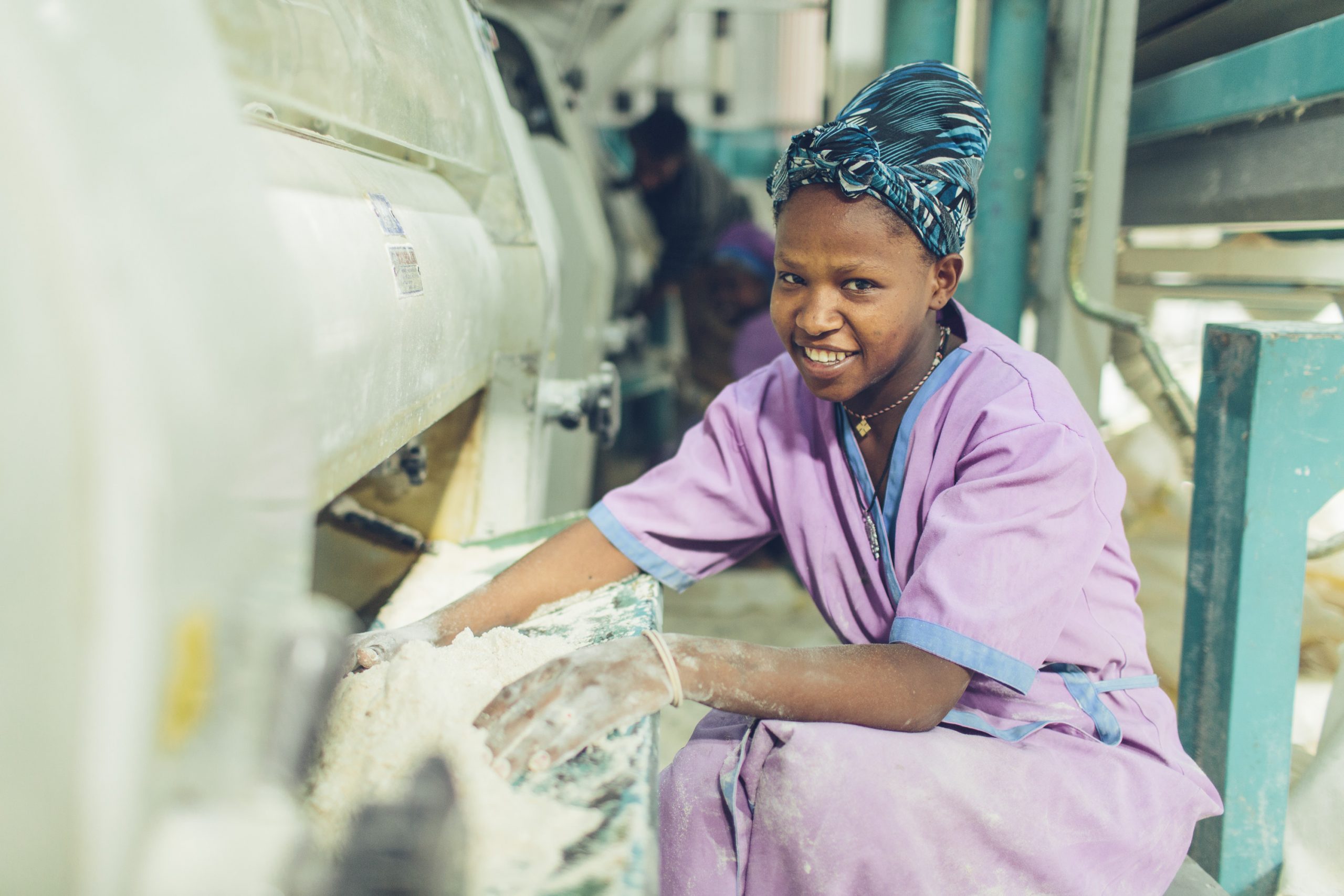 A woman working at a grain mill in Sannie, Ethiopia