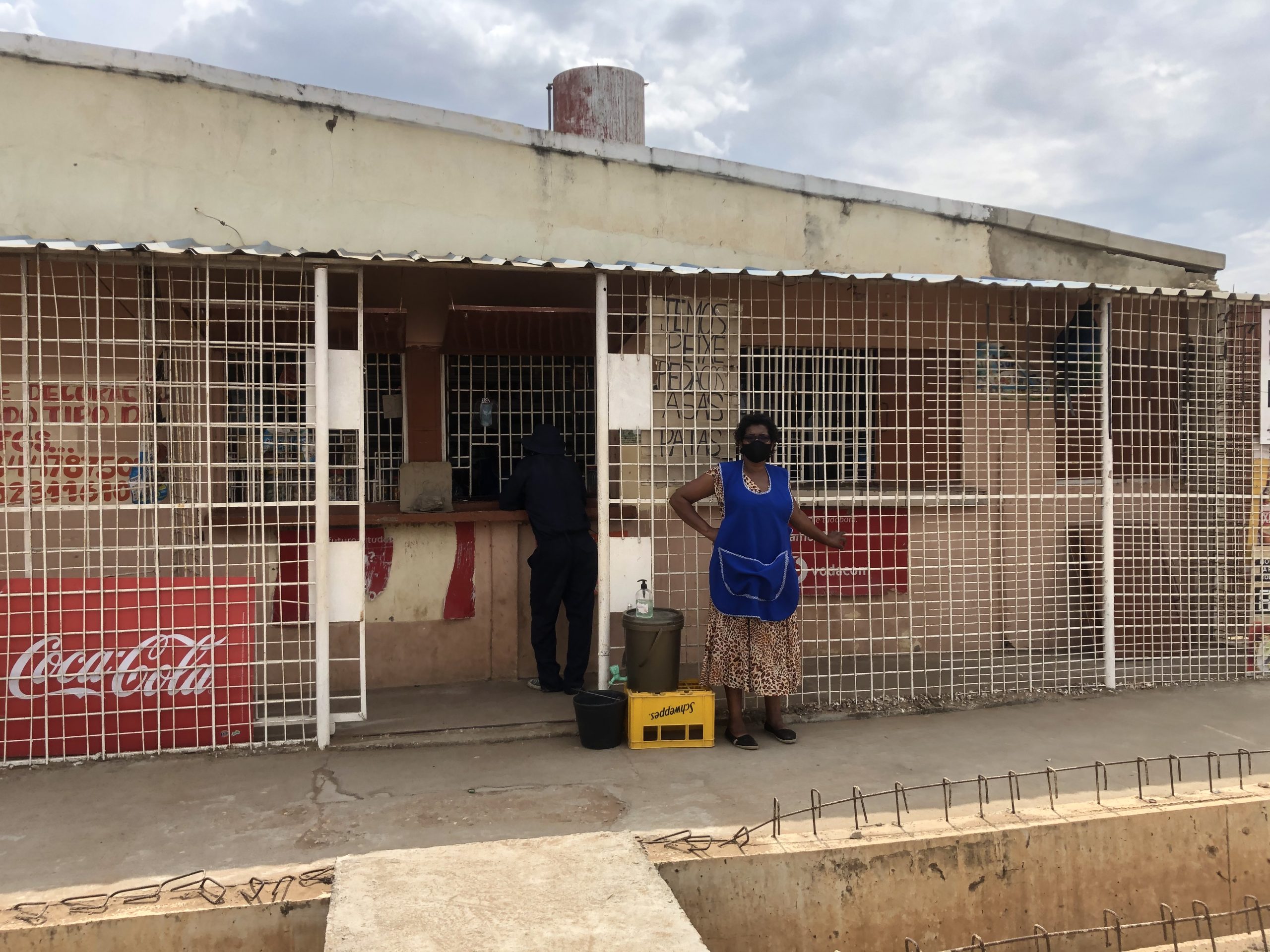 Rita Sitóe stands outside her shop near Maputo, Mozambique.