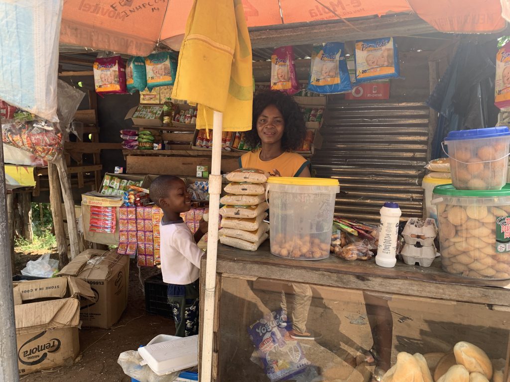 Ermelinda Cumbe, a woman entrepreneur, works at her grocery street stall in Mozambique.