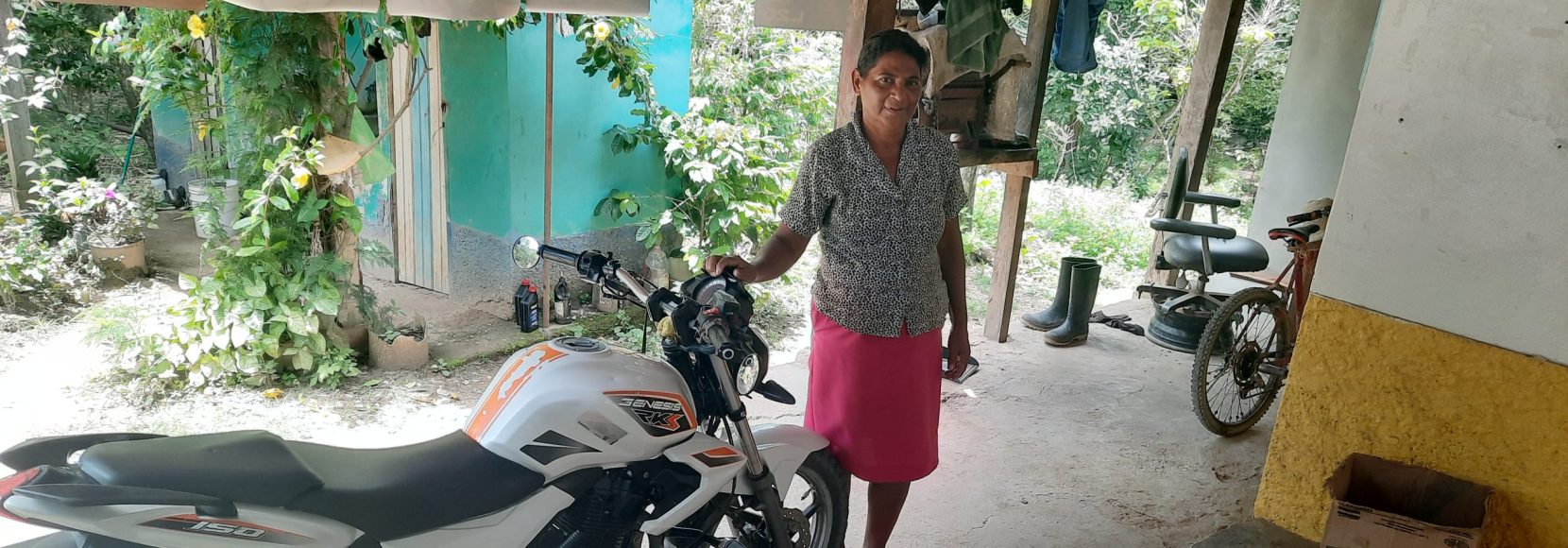 Maria Rosales with her motorcycle in Honduras