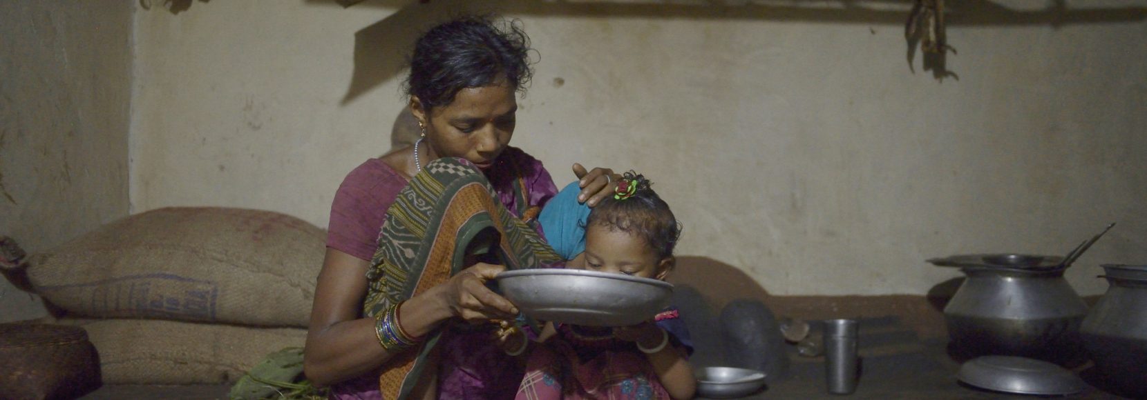 A woman feeds her daughter in the Rayagada district of Odisha, India. Photo Credit- Rohit Jain