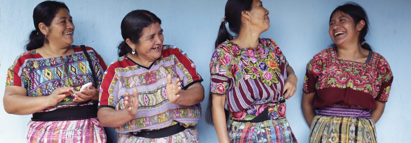 Four women in Guatemala stand together. Part of TechnoServe's December 2023 news quiz.