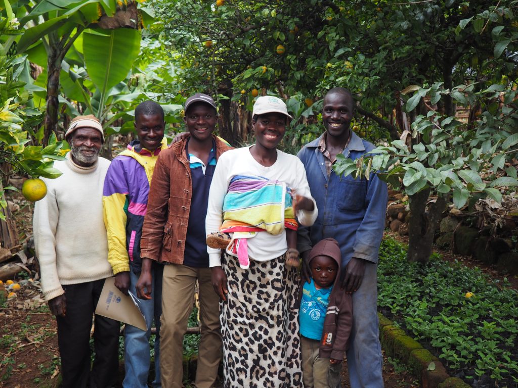 Coffee farmers in Zimbabwe’s Honde Valley. From left to right: Samuel Nyakuchena, Ruben Muranda, Tafadzwa Nyakuchena, Elizabeth Nyamadzwo, and Fanuel Munyuku. Photo by Rebecca Regan-Sachs for TechnoServe.