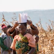 Judis Mkondga (center) participating in a farmer training as part of TechnoServe’s SAPPHIRE II maize project in Tanzania. The project reached nearly 30,000 smallholder maize farmers—50% of whom were women— in the Mbeya and Ruvuma regions with training on improved agronomic and post-harvest practices.