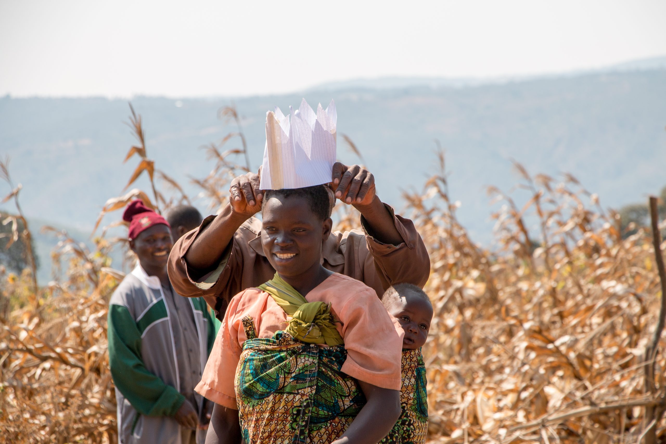 Judis Mkondga (center) participating in a farmer training as part of TechnoServe’s SAPPHIRE II maize project in Tanzania. The project reached nearly 30,000 smallholder maize farmers—50% of whom were women— in the Mbeya and Ruvuma regions with training on improved agronomic and post-harvest practices.