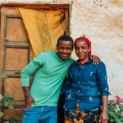 Lubaba Mekonnen (right) and her son, Mohammed Jamal, outside their house in Ethiopia’s Jimma zone. (TechnoServe / Olivia Sakai)